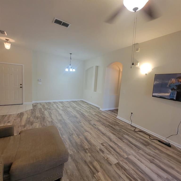 3351 Whitestone Circle, Unit 105 Kissimmee, FL 34741 - Photo 21 of 22 a view of a livingroom with wooden floor