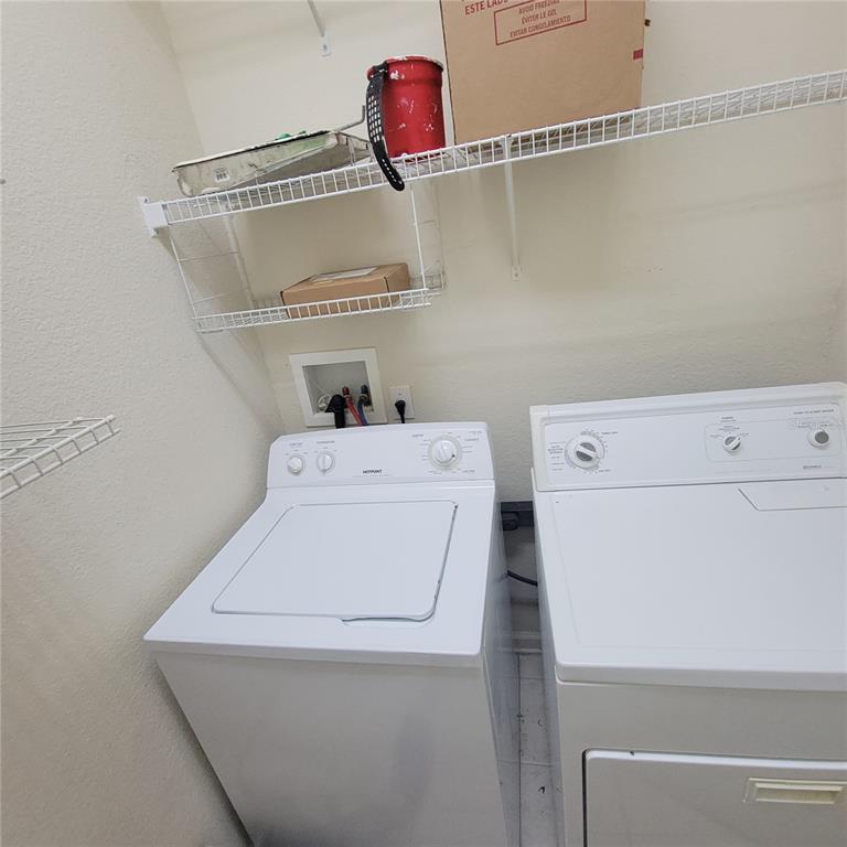 3351 Whitestone Circle, Unit 105 Kissimmee, FL 34741 - Photo 22 of 22 a utility room with dryer and washer