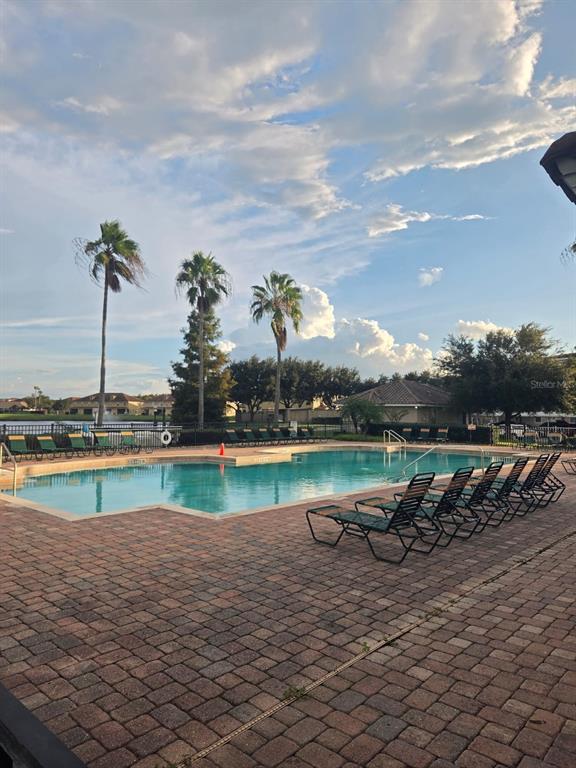 3351 Whitestone Circle, Unit 105 Kissimmee, FL 34741 - Photo 3 of 22 a view of a lake