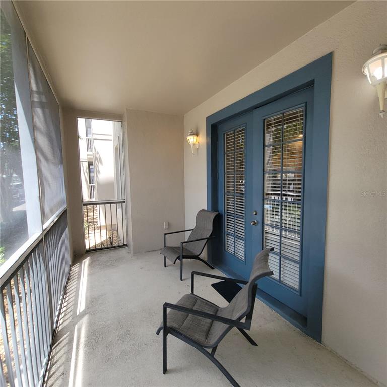 3351 Whitestone Circle, Unit 105 Kissimmee, FL 34741 - Photo 6 of 22 a living room with furniture and a window