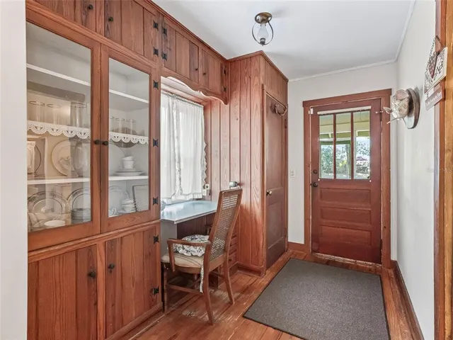 a kitchen that has a stove and a table in it