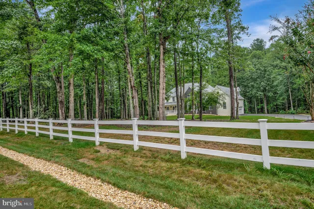 a living room with furniture window and wooden floor