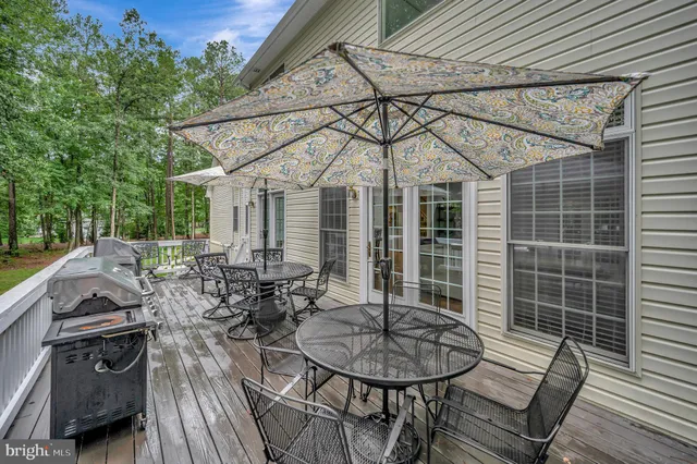 a view of living room with furniture and wooden floor