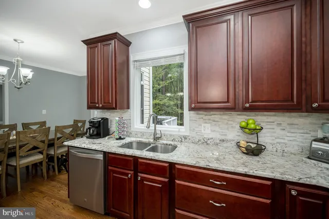 an aerial view of a house with a yard and outdoor seating