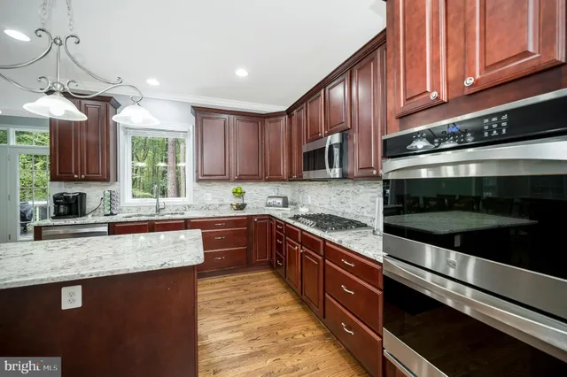 a aerial view of a house with a yard