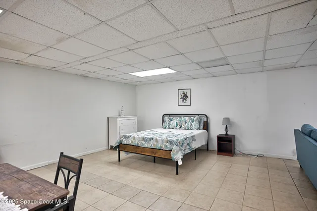 a room with a bed and a chair in it