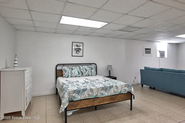 a bedroom with a bed and a night stand