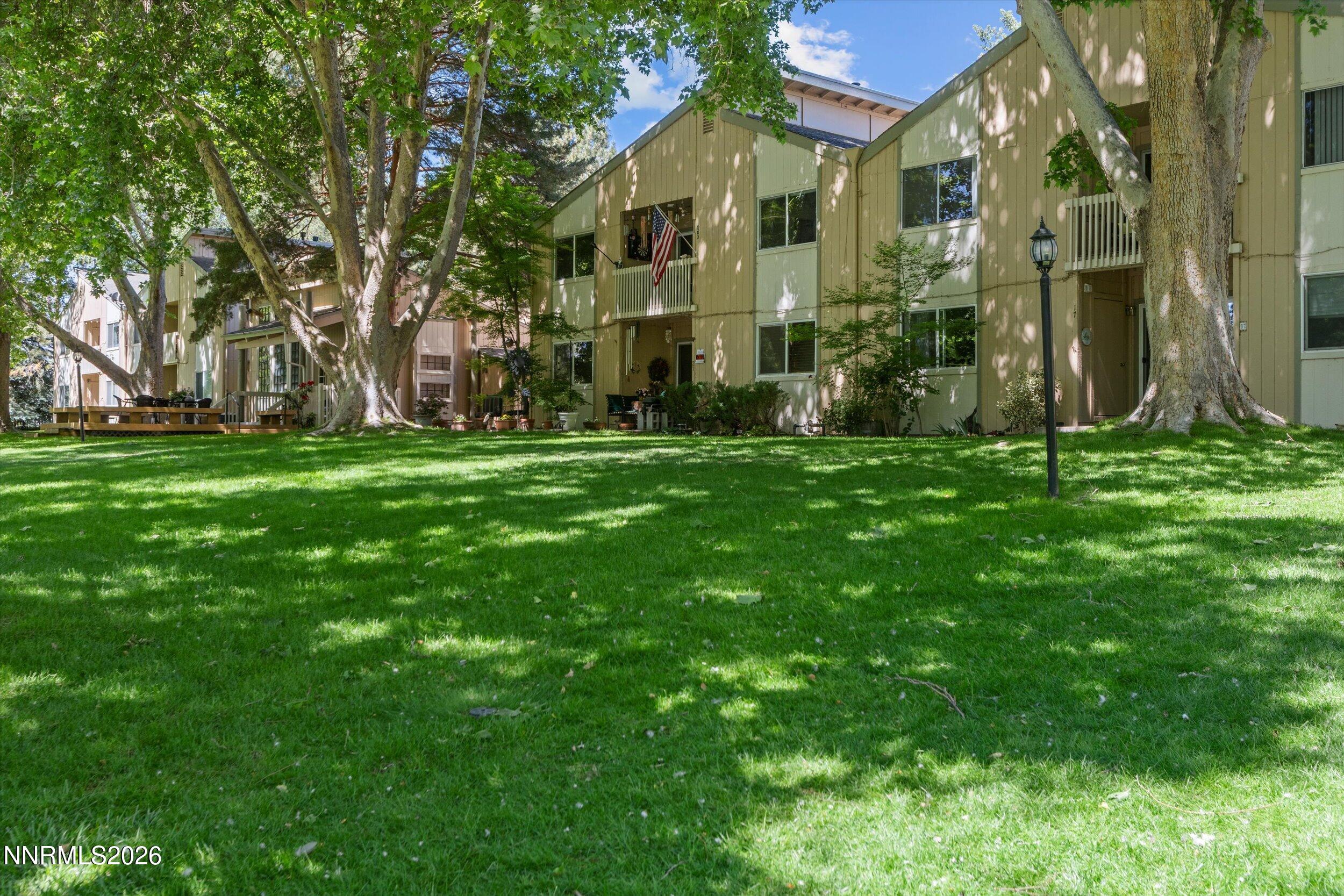 2300 Dickerson Road, Unit 51 Reno, NV 89503 - Photo 2 of 46 a view of a big yard with plants and large trees