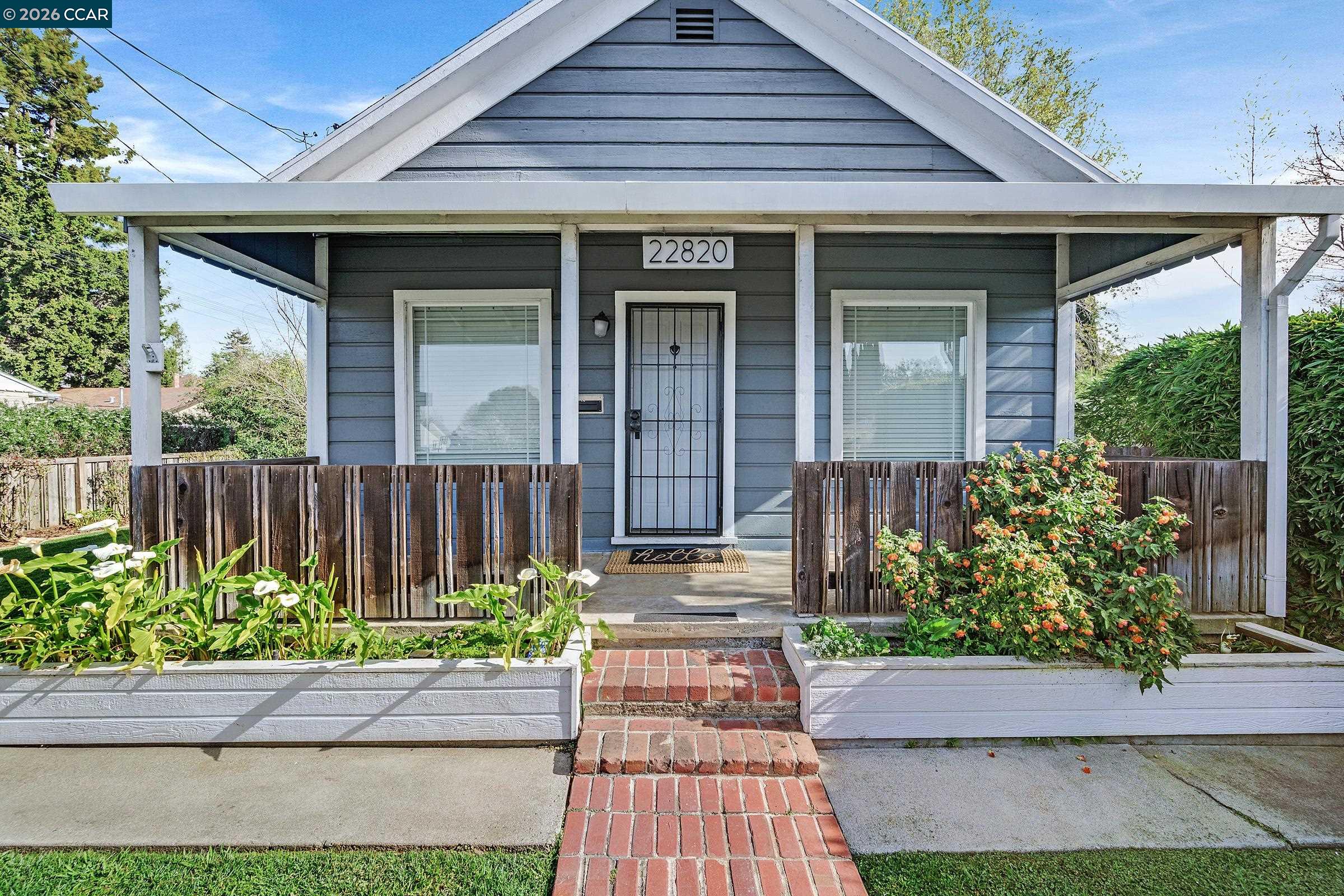 a front view of a house with garden