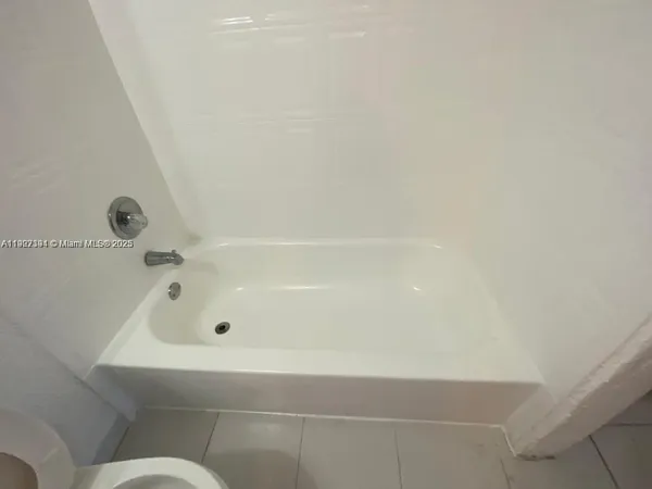 a view of a tree in front of a house