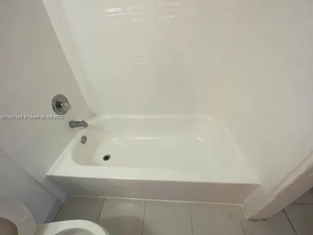 a view of a tree in front of a house