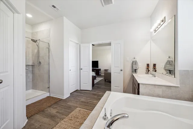 a bedroom with a bed and a view of bathroom