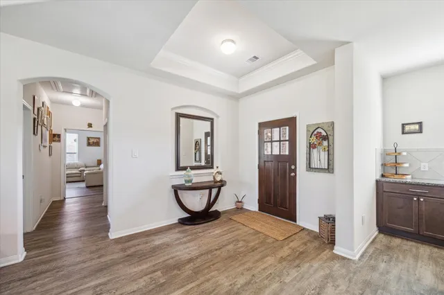 a view of a room and wooden floor