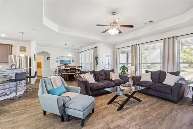 a living room with furniture and a large window