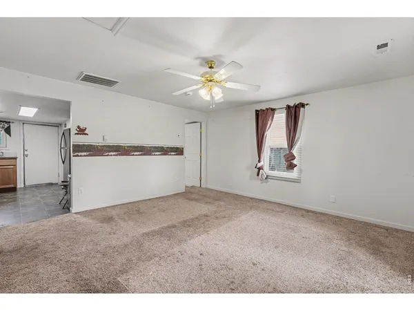 a view of a kitchen with a sink and a cabinet