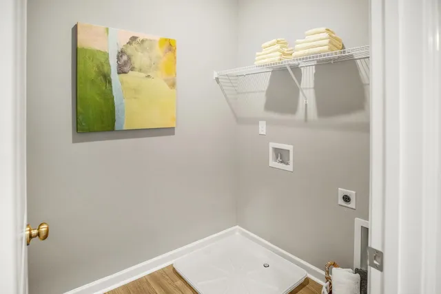 a bathroom with a window and a shower