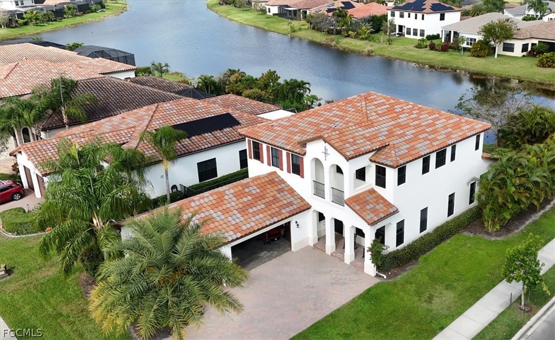 an aerial view of house with yard
