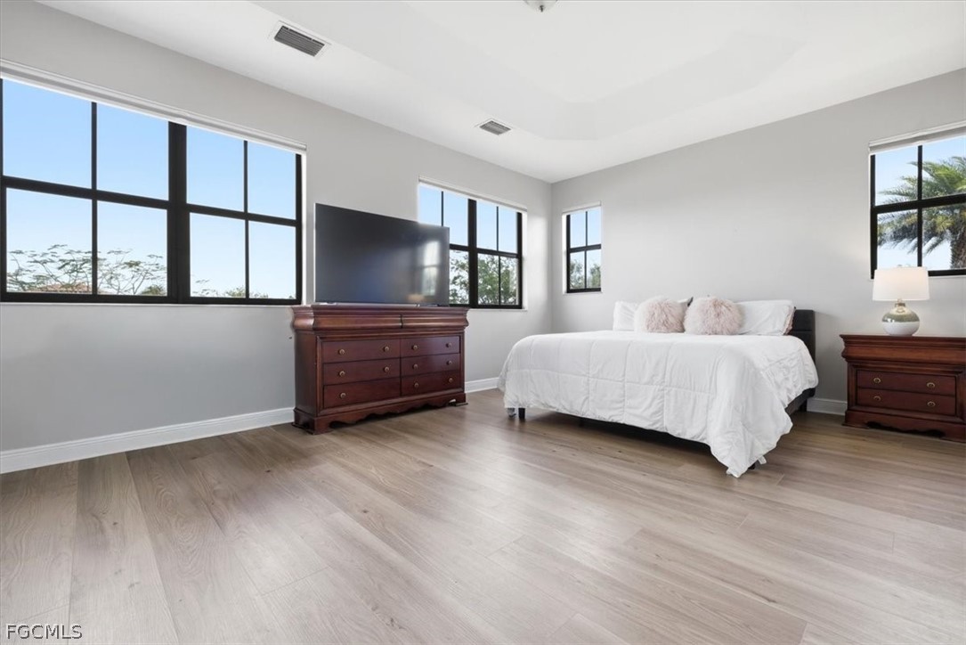 5245 Messina Street Ave Maria, FL 34142 - Photo 17 of 44 a bedroom with a bed and a flat screen tv