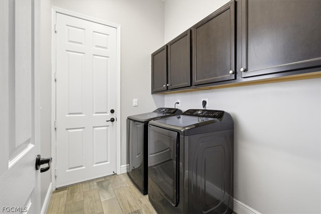 5245 Messina Street Ave Maria, FL 34142 - Photo 21 of 44 a utility room with cabinets