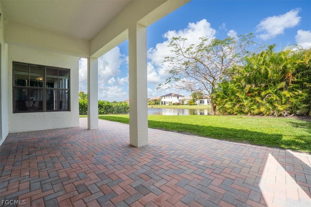 5245 Messina Street Ave Maria, FL 34142 - Photo 34 of 44 a view of a house with a yard