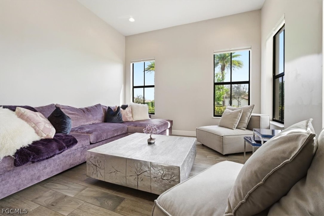 5245 Messina Street Ave Maria, FL 34142 - Photo 4 of 44 a living room with furniture and a large window