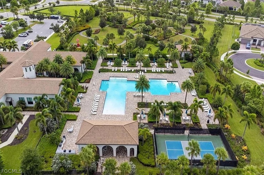 5245 Messina Street Ave Maria, FL 34142 - Photo 41 of 44 an aerial view of a house with a garden and lake view