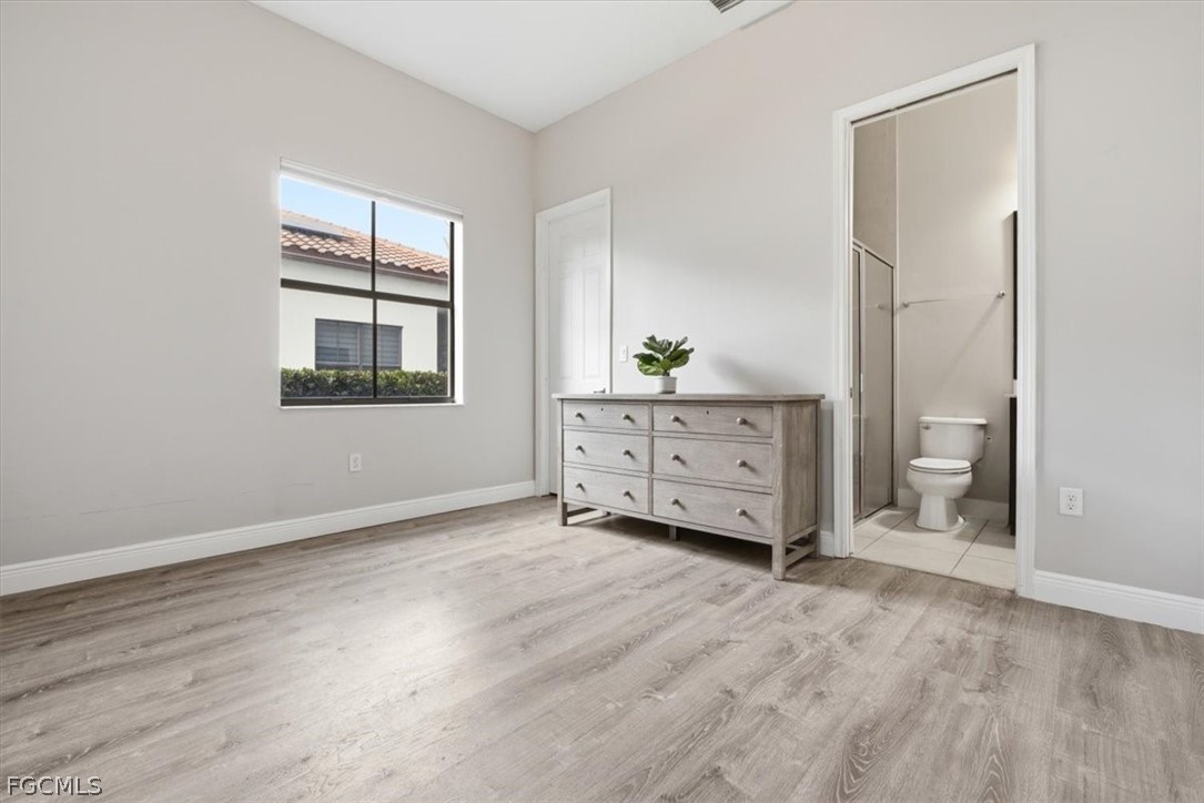5245 Messina Street Ave Maria, FL 34142 - Photo 6 of 44 a view of an empty room with a window