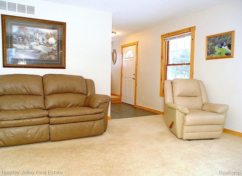 9101 North Latson Road Howell, MI 48855 - Photo 6 of 16 Foyer to Living Room