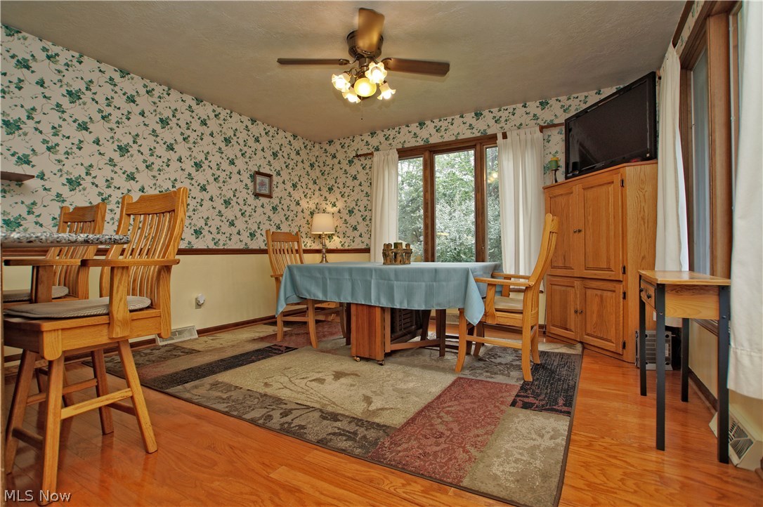 1273 Ford Road Lyndhurst, OH 44124 - Photo 9 of 32 Lighted ceiling fan in large hardwood dining area.