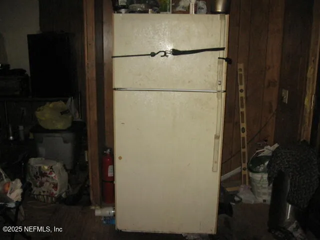 a white refrigerator freezer and a stove
