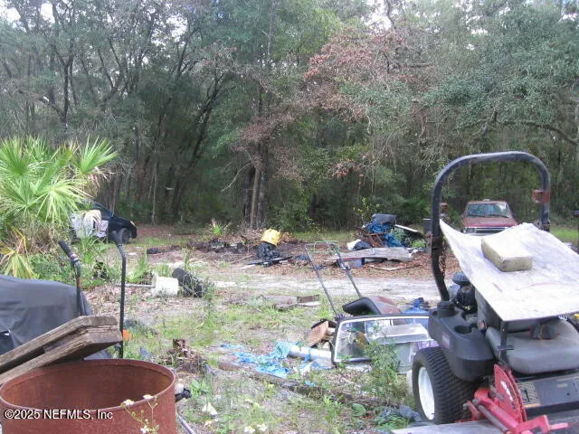 a backyard of a house with yard and outdoor seating