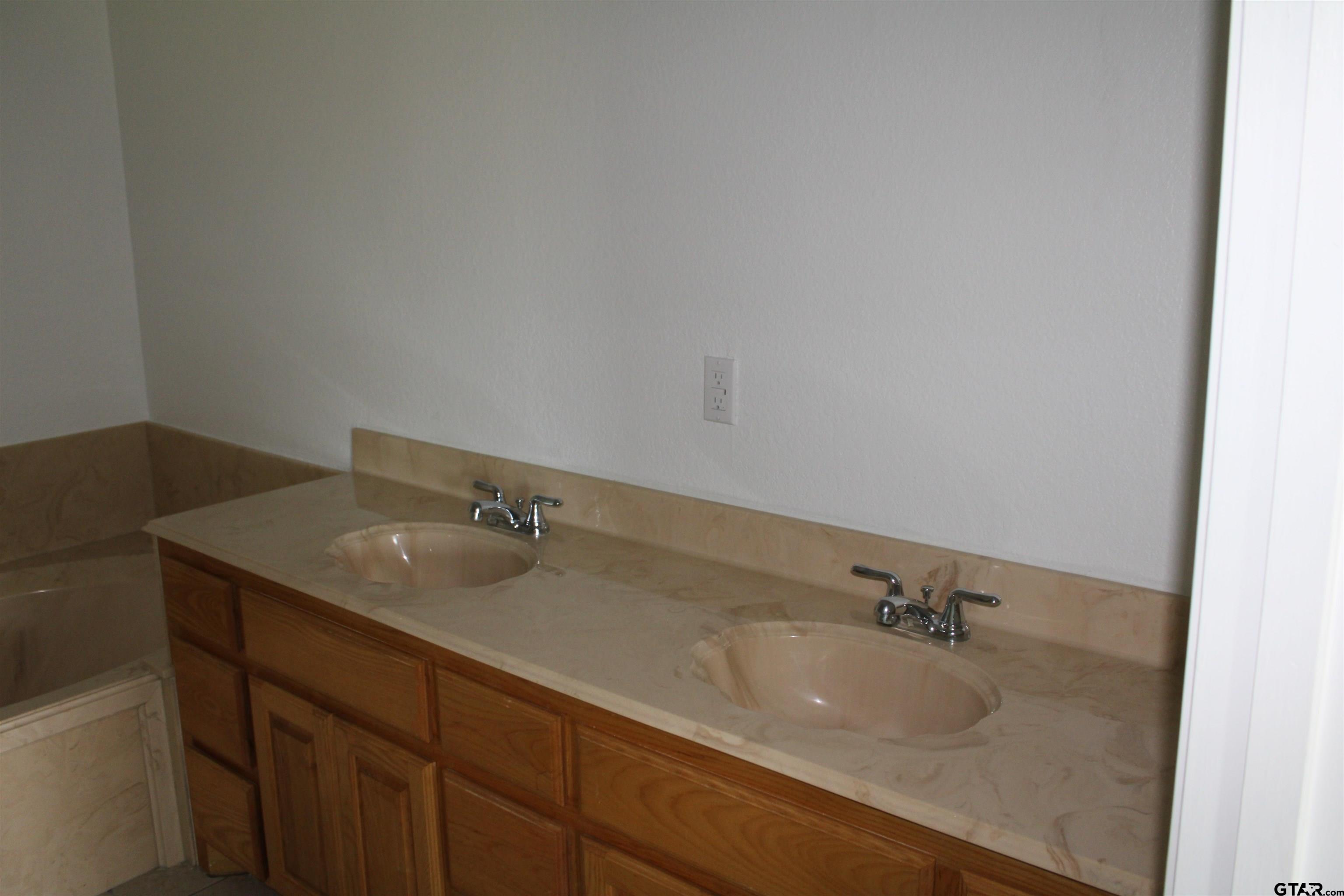 1055 County Road 1314 Rusk, TX 75785 - Photo 11 of 25 a bathroom with a granite countertop sink and mirror