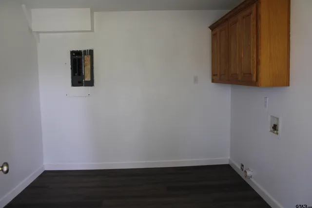 a view of door with wooden floor