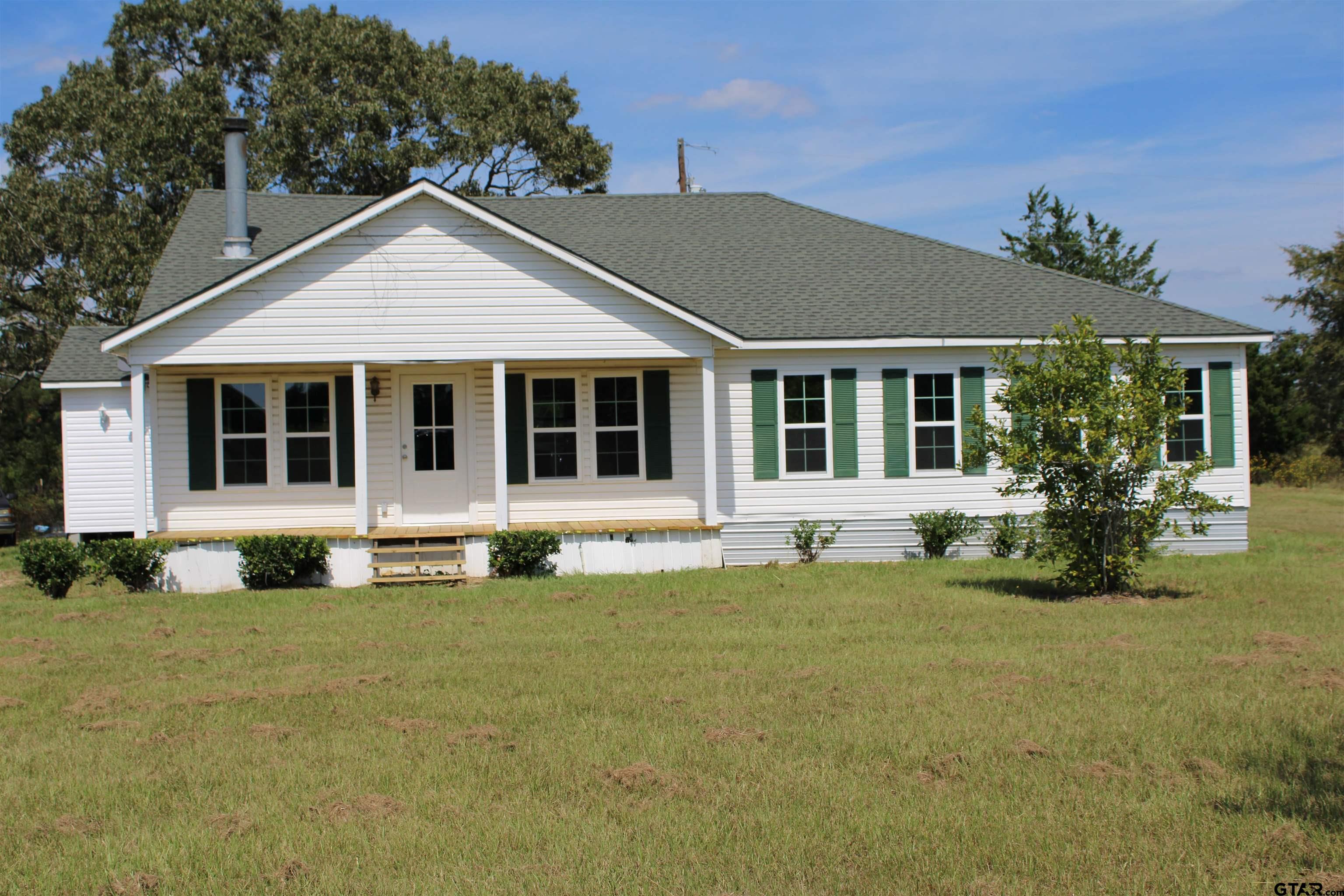 1055 County Road 1314 Rusk, TX 75785 - Photo 21 of 25 a front view of a house with a yard