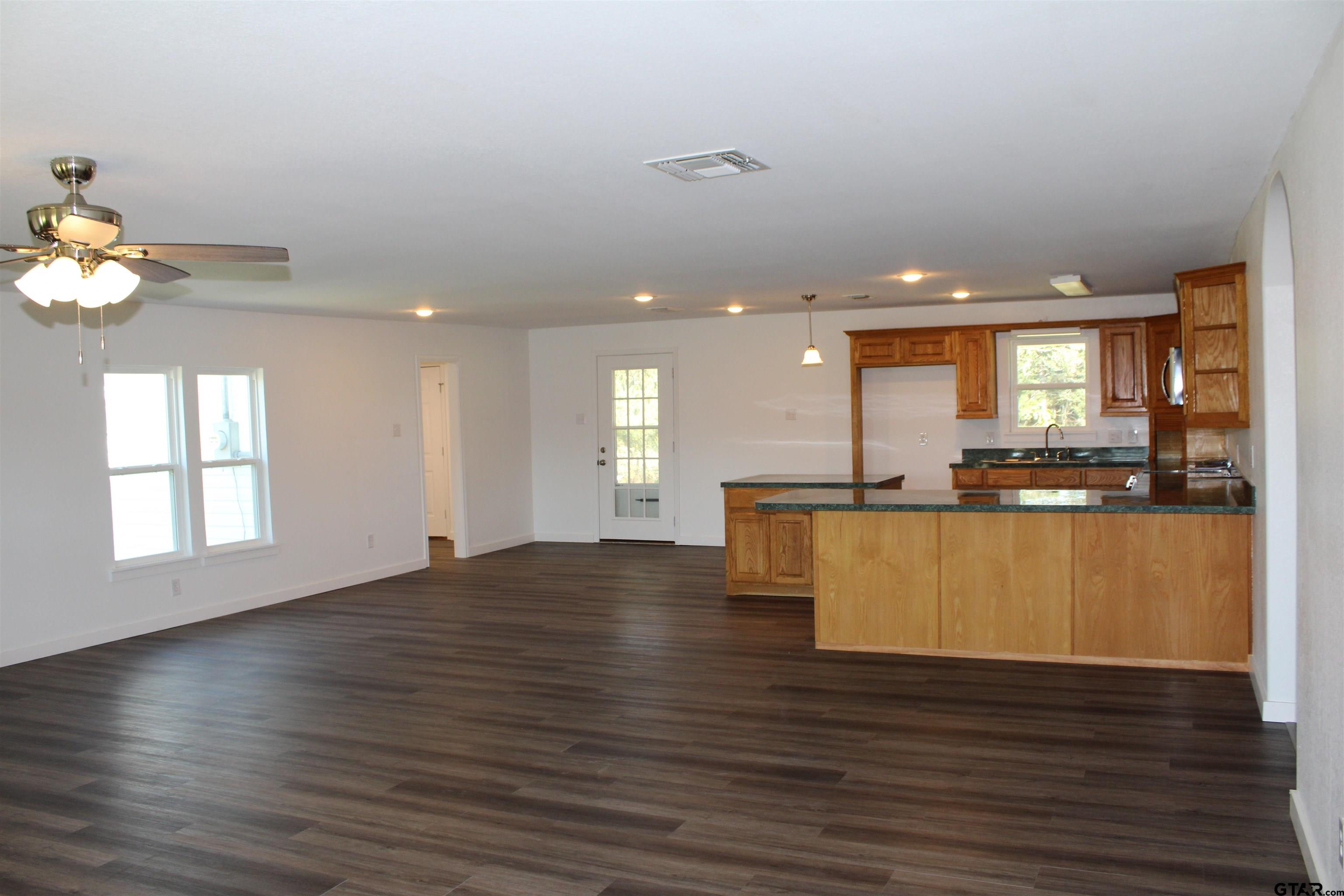 1055 County Road 1314 Rusk, TX 75785 - Photo 23 of 25 a view of kitchen with cabinets and wooden floor