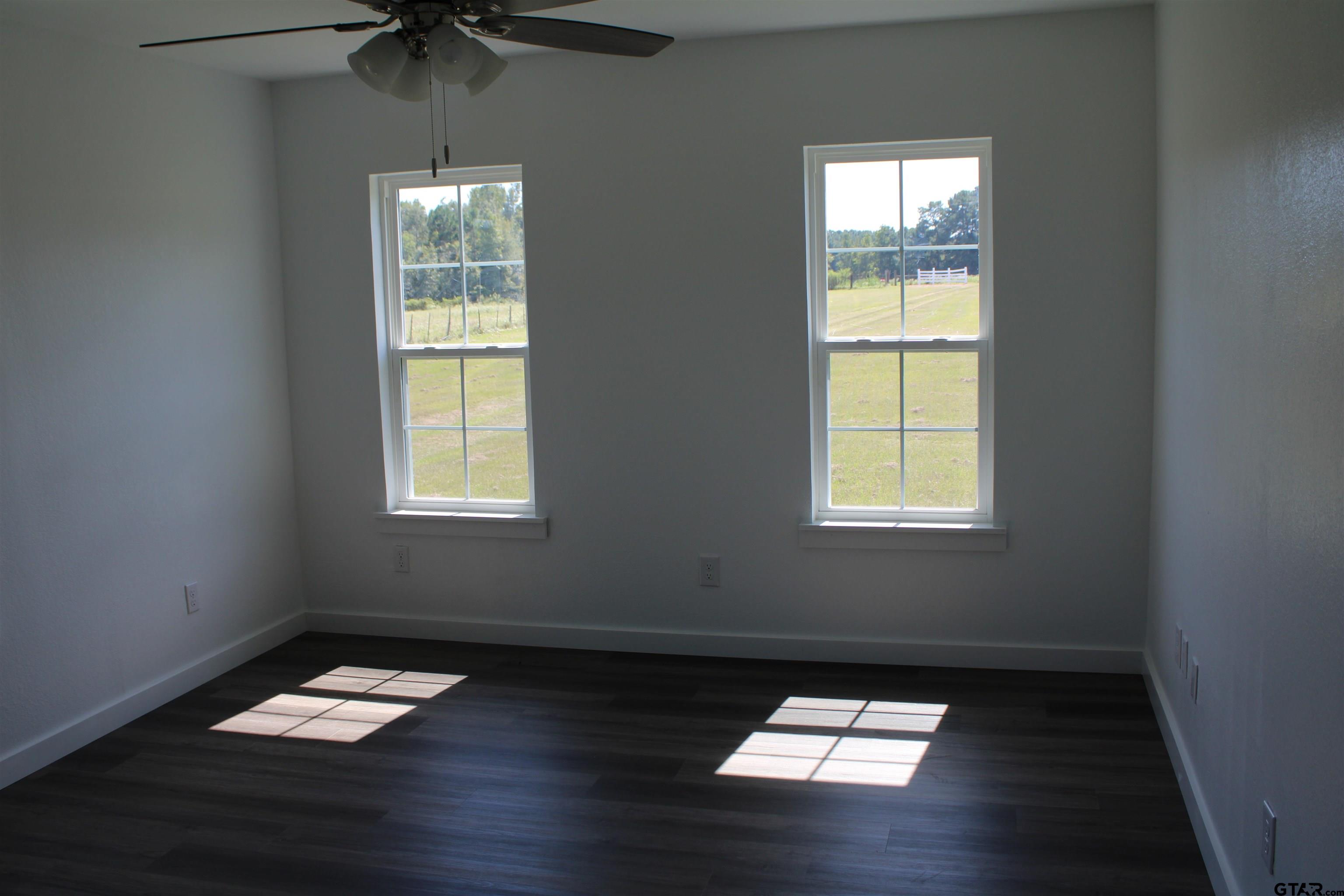 1055 County Road 1314 Rusk, TX 75785 - Photo 7 of 25 an empty room with a window
