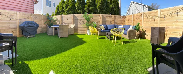 a view of yard with patio