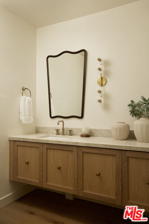 17539 West Magnolia Boulevard Encino, CA 91316 - Photo 12 of 31 a bathroom with a sink and a mirror
