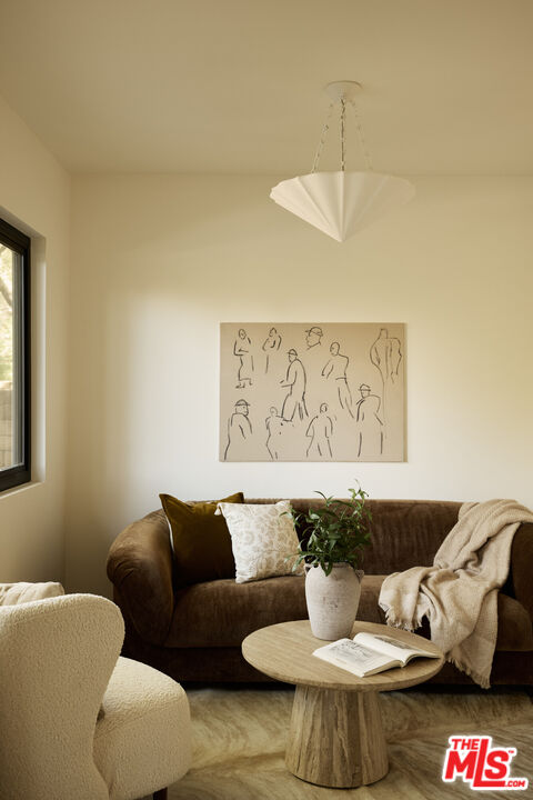 17539 West Magnolia Boulevard Encino, CA 91316 - Photo 17 of 31 a living room with furniture and a window
