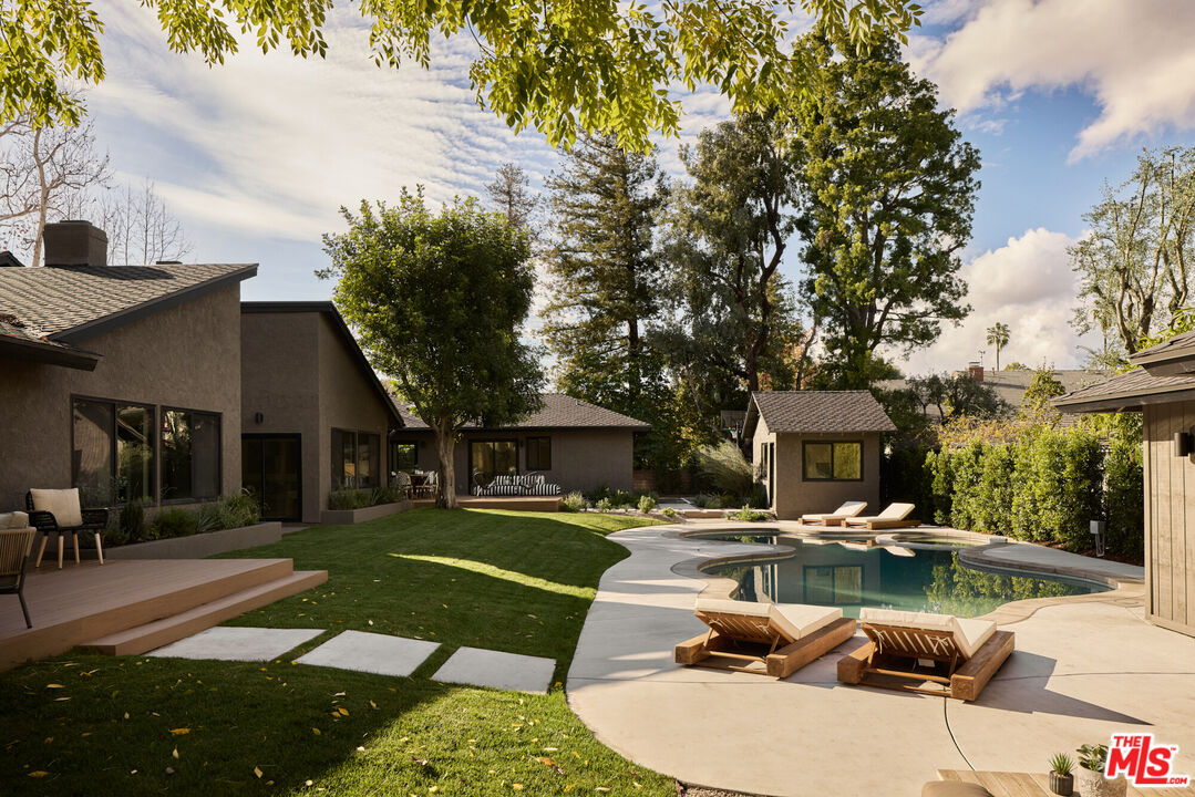 17539 West Magnolia Boulevard Encino, CA 91316 - Photo 2 of 31 a swimming pool view with a outdoor seating