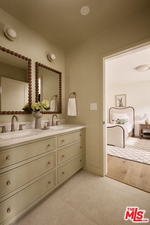 17539 West Magnolia Boulevard Encino, CA 91316 - Photo 22 of 31 a bathroom with a sink and a mirror