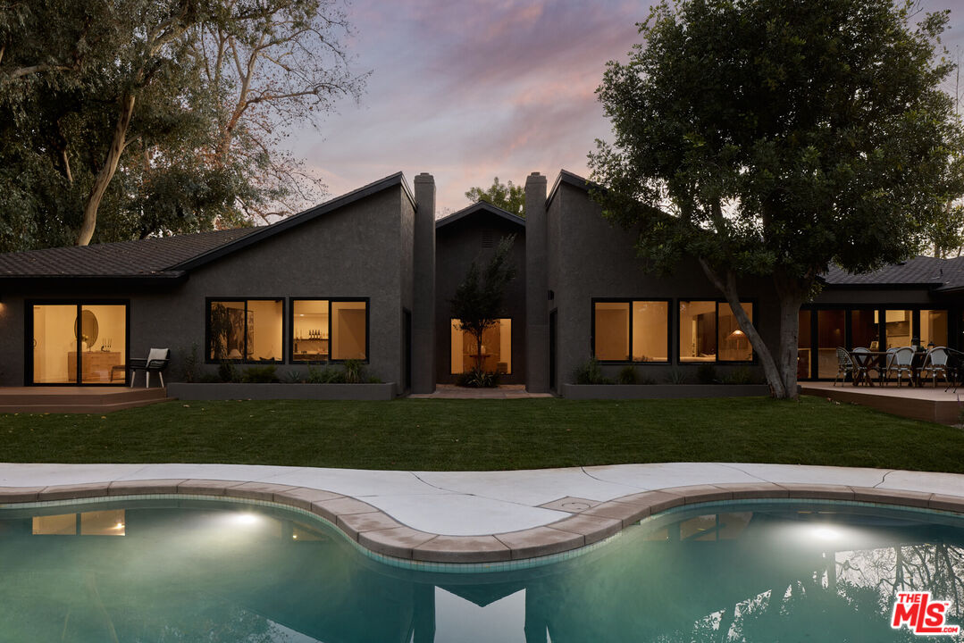 17539 West Magnolia Boulevard Encino, CA 91316 - Photo 30 of 31 a view of a house with a yard