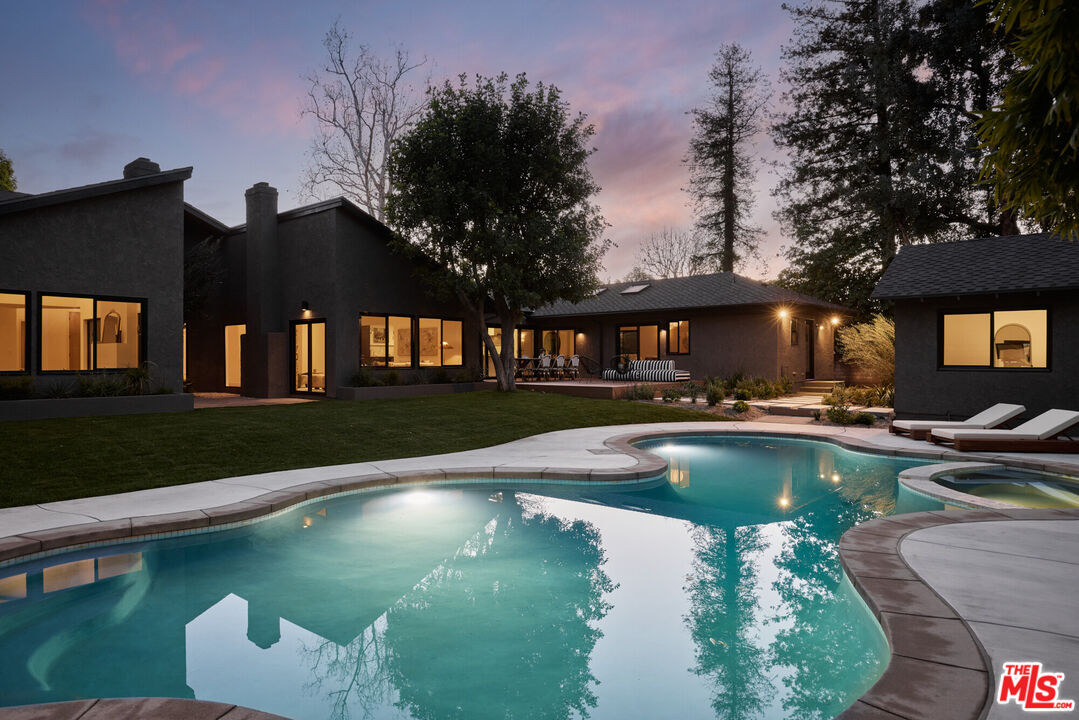 17539 West Magnolia Boulevard Encino, CA 91316 - Photo 31 of 31 a view of a swimming pool with lounge chair