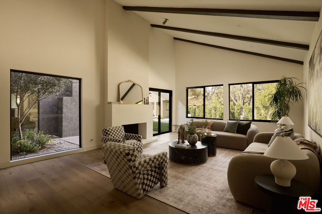 17539 West Magnolia Boulevard Encino, CA 91316 - Photo 5 of 31 a living room with furniture and a large window