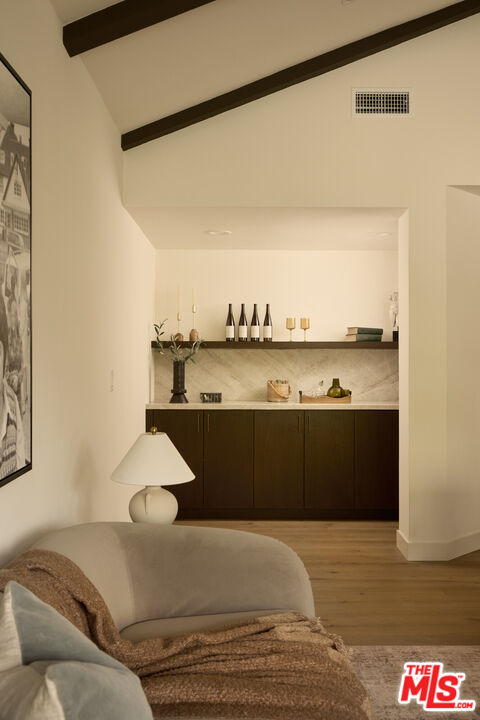 17539 West Magnolia Boulevard Encino, CA 91316 - Photo 6 of 31 a bedroom with a bed and cabinet