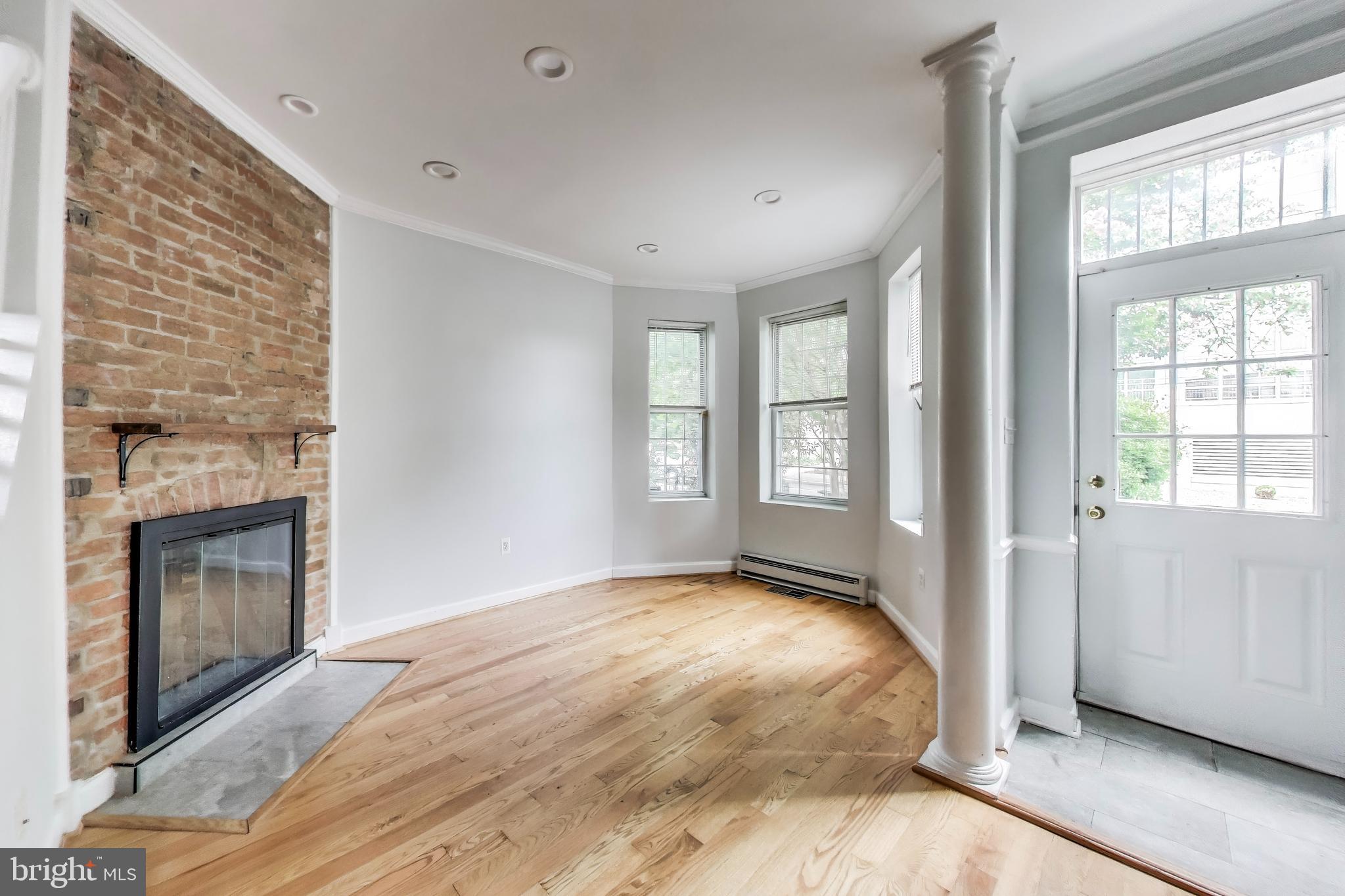 1327 1st Street Northwest Washington, DC 20001 - Photo 3 of 18 a view of a livingroom with a fireplace and window