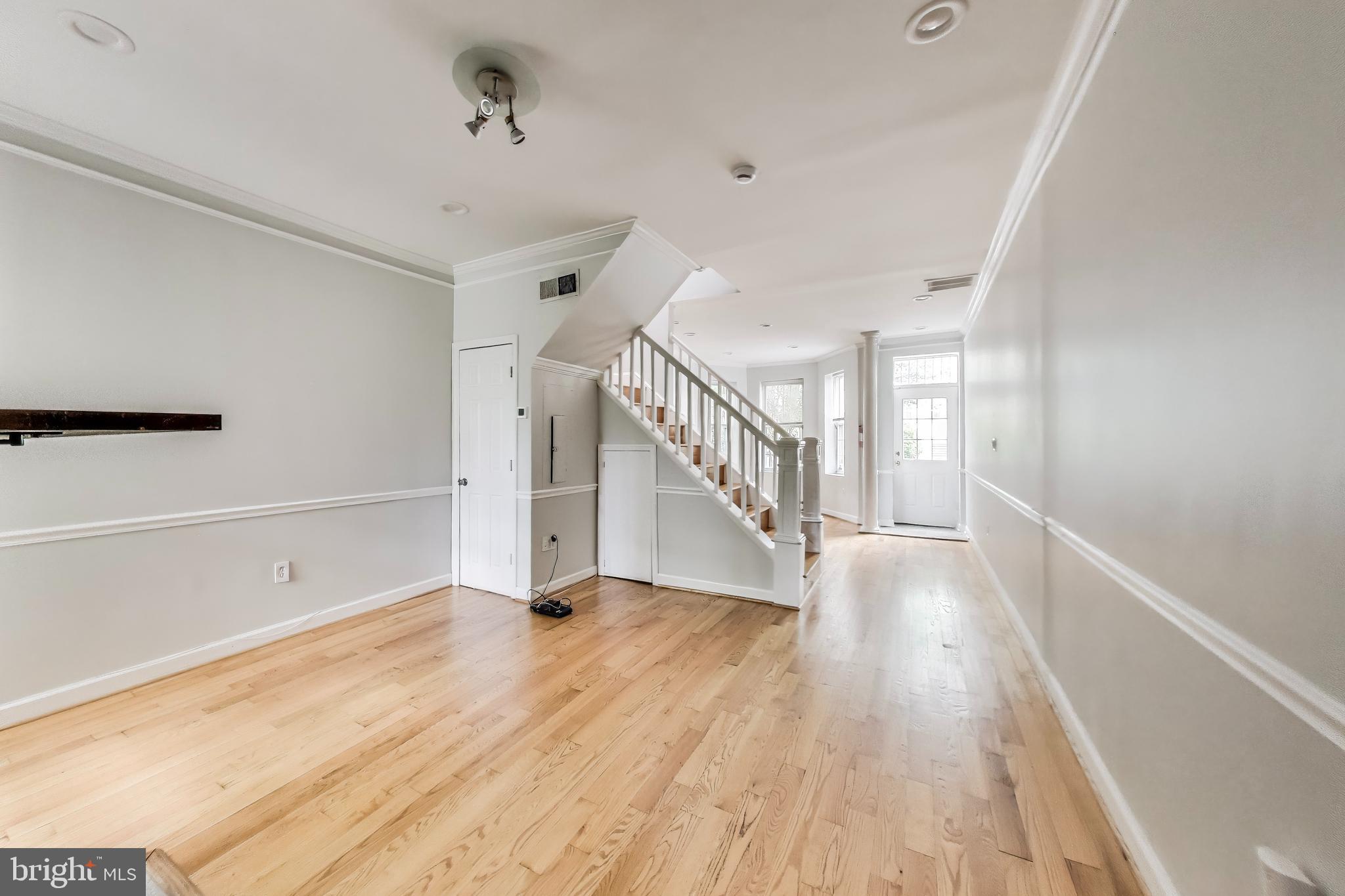 1327 1st Street Northwest Washington, DC 20001 - Photo 4 of 18 a view of an empty room with wooden floor