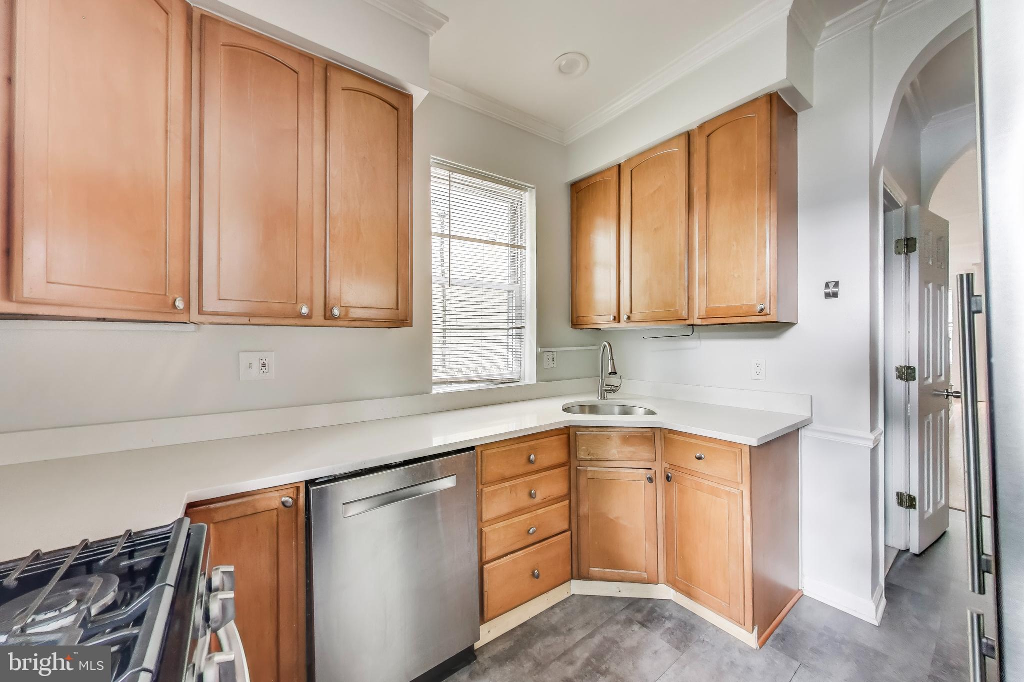 1327 1st Street Northwest Washington, DC 20001 - Photo 6 of 18 a kitchen with stainless steel appliances granite countertop a sink and dishwasher with cabinets