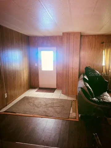 a view of an empty room and window and stairs