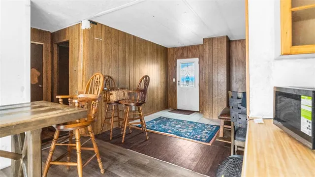 a view of a dining room with furniture and a fireplace